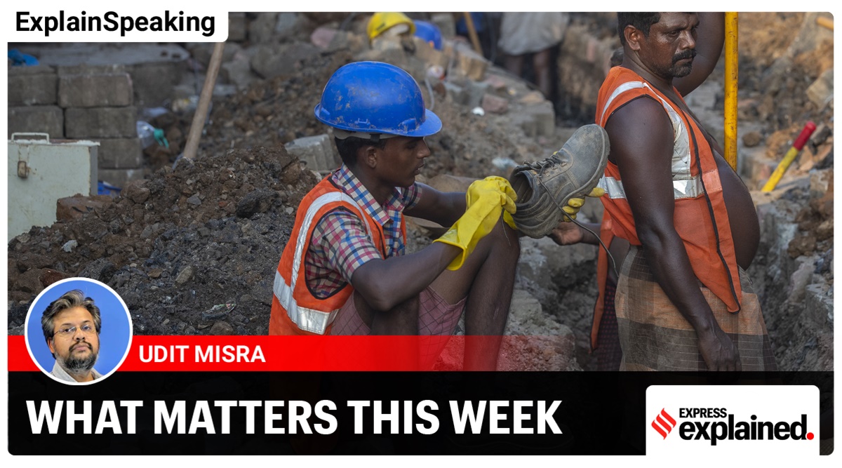 A worker fixes his show as he prepares work to lay an underground electricity cable in Mumbai (AP)