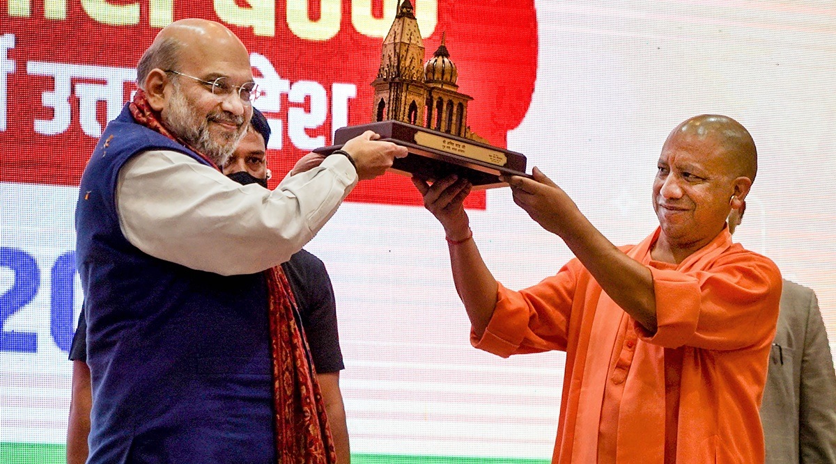 Union Home Minister Amit Shah receives a memento from UP Chief Minister Yogi Adityanath during a BJP rally in Varanasi on Friday. (Photo: PTI)