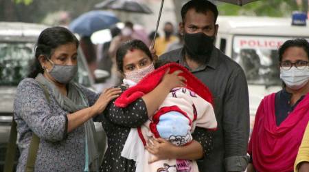 Anupama Chandran and Ajith Kumar with their son. (Express Photo)