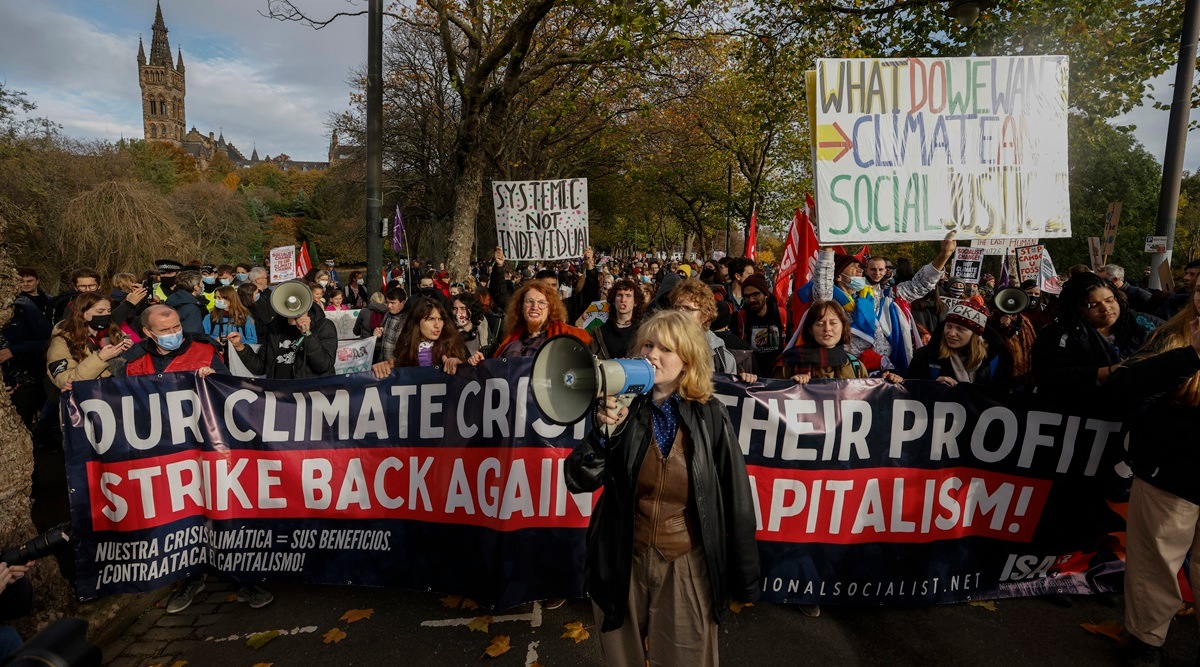 Climate activists march through the streets of Glasgow, Scotland on Friday, Nov. 5, 2021. (Kieran Dodds/The New York Times)