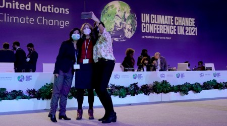 Delegates pose for a selfie at the plenary room in Glasgow on Saturday. (Photo: AP)