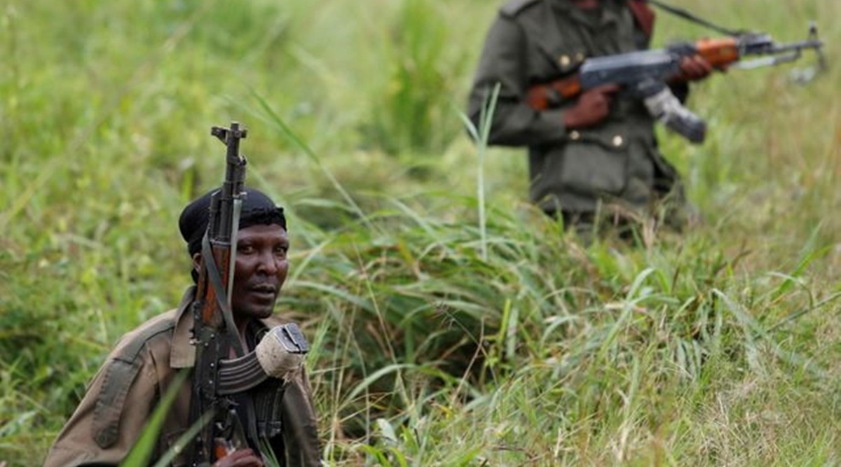 Armed Forces of the Democratic Republic of the Congo (FARDC) soldiers rest next to a road after Islamist rebel group called the Allied Democratic Forces (ADF) attacked area around Mukoko village, North Kivu province of Democratic Republic of Congo, December 11, 2018. (Reuters)