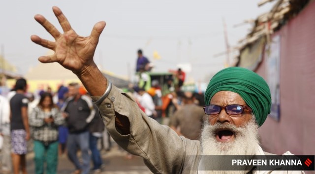 Farmers celebrate after PM Narendra Modi announced the repealing of the three farm laws, at Singhu Border in New Delhi. 
