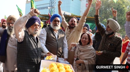 Farmers celebrate after PM Narendra Modi announced the repealing of the three farm laws, near Ferozepur road in Ludhiana. (Express photo by Gurmeet Singh)