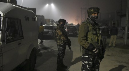 Security personnel stand guard during an encounter with militants at Hyderpora, in Srinagar. (PTI/File)
