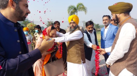 The devotees were welcomed with flower garlands as they crossed the border by Pakistan Sikh Gurudwara Parbandhak Committee president, Ameer Singh, CEO of Project Management Unit, Muhammad Latif, and MPA Ramesh Singh Arrora, among others. (Express Photo)