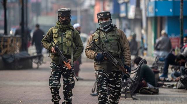 Paramilitary soldiers patrol in a market in Srinagar, Kashmir. (AP)