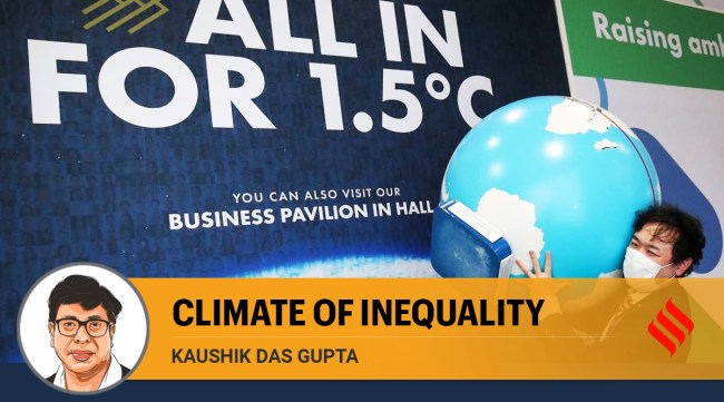 A person carries a globe model during the UN Climate Change Conference (COP26) in Glasgow, Scotland, Britain, November 8, 2021. (Reuters)