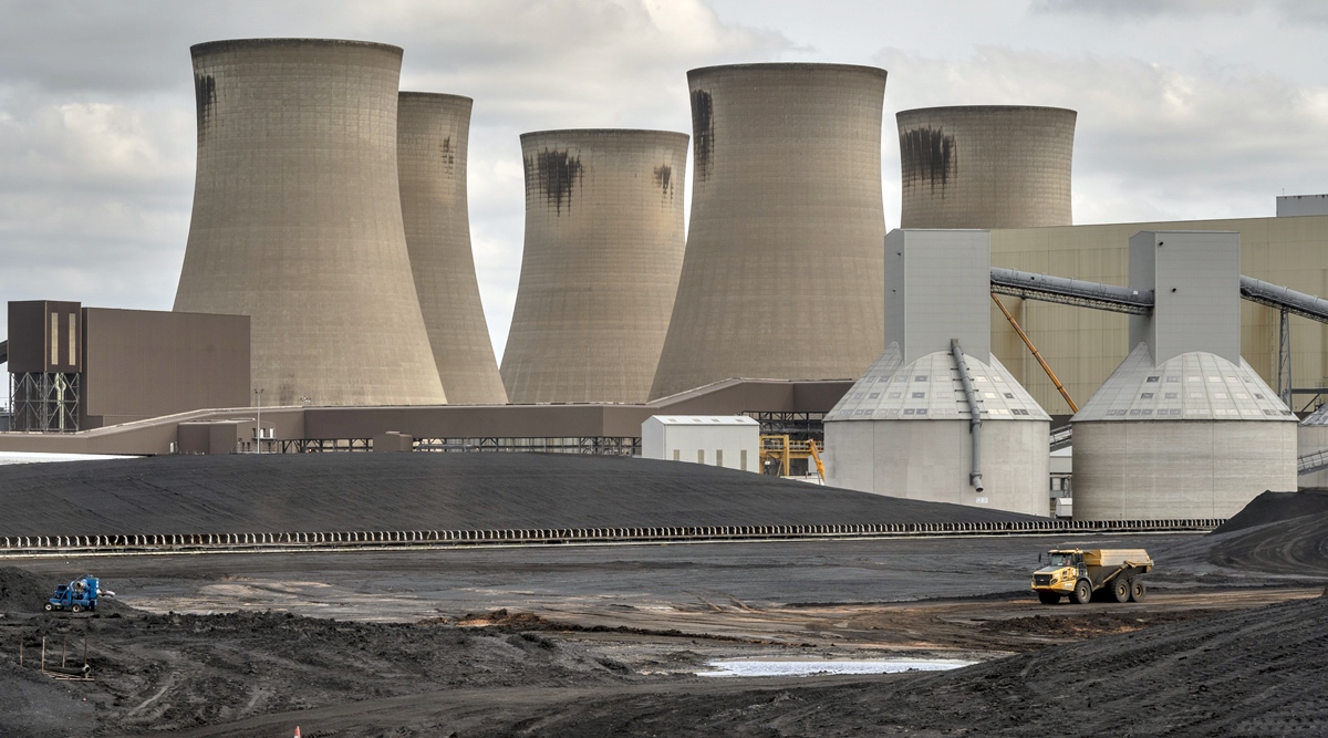 Coal reserves behind a power station in Drax, England, Sept. 18, 2020. (Andrew Testa/The New York Times)