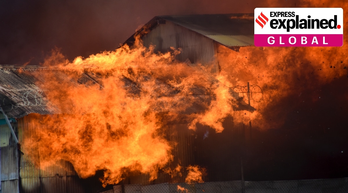 A building burns in Chinatown, in the capital city of Honiara, Solomon Islands, Friday, Nov. 26, 2021. (AP Photo/Piringi Charley)
