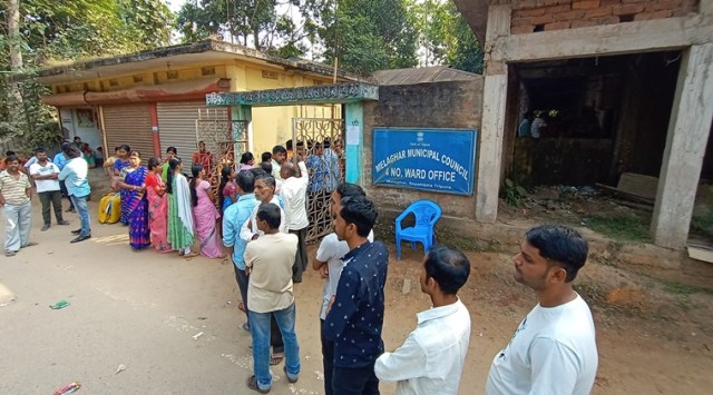 Voters wait in queue in front of a polling center at Melaghar municipal council. (Express Photo/file)