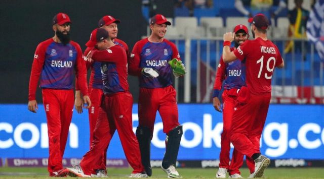 England's Jos Buttler, centre, celebrates with teammates the dismissal of Sri Lanka's captain Dasun Shanaka during the Cricket Twenty20 World Cup match between England and Sri Lanka in Sharjah, UAE, Monday, Nov. 1, 2021. (AP Photo/Aijaz Rahi)