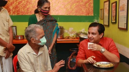 K R Vijayan with Kerala Minister Mohd Riyas. (Express photo)