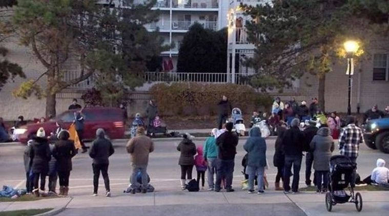A red SUV speeds past attendees moments before plowing into a crowd at a Christmas parade in Waukesha, Wisconsin. (Reuters)