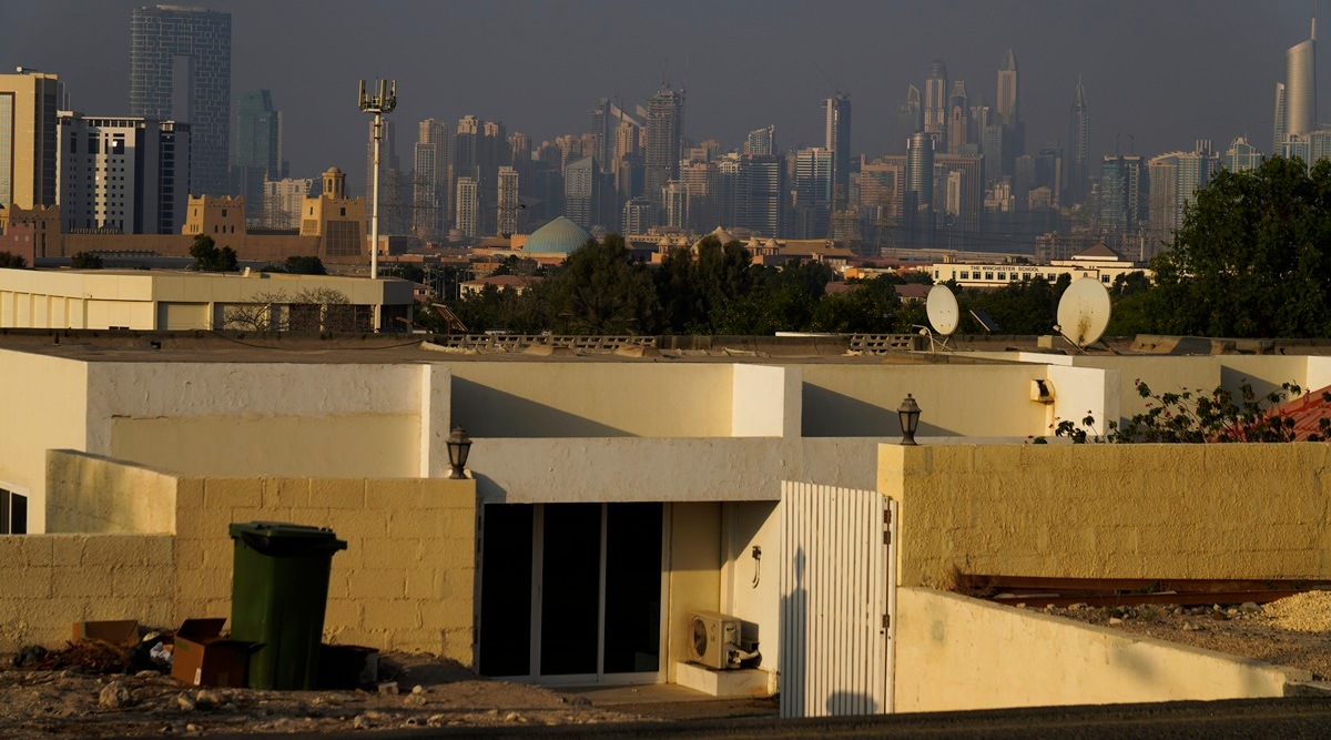 A village at Jebel Ali Village is seen with the Dubai skyline behind it in Dubai, United Arab Emirates, Tuesday, Nov. 2, 2021. Nakheel, the state-owned developer of Dubai's signature palm-shaped islands, has unveiled plans to demolish the neighborhood to make way for a gated community of flashy, two-story villas. Residents of the village, which dates back to the late 1970s, have received eviction notices and say they're upset to leave the quiet neighborhood. (AP)