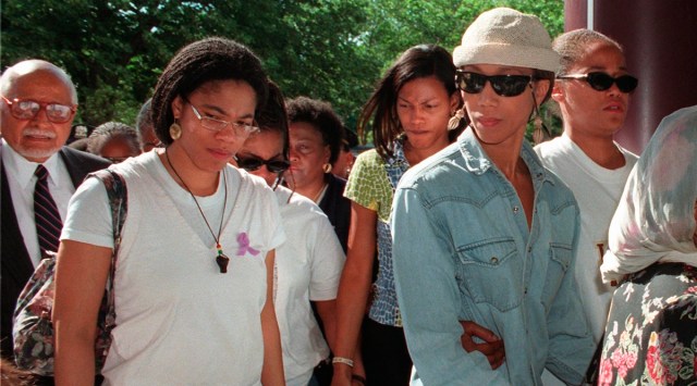 Malikah Shabazz, left, daughter of Malcolm X, walks with her sisters, Ilyasah, third from right, Attallah, second from right, and Malaak, after talking to the media following the death of their mother Betty Shabazz, June 23, 1997 in New York. (AP)
