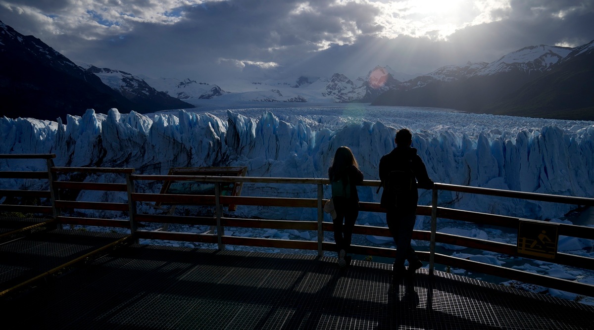 Tourists watch the Perito Moreno Glacier at Los Glaciares National Park, near El Calafate, Argentina, Monday, Nov. 1, 2021. (AP)