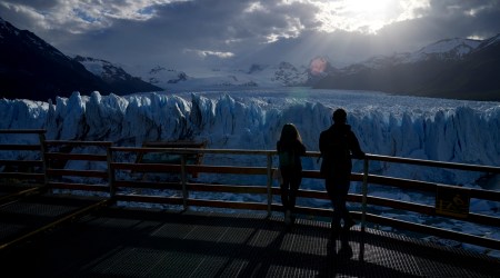 Tourists watch the Perito Moreno Glacier at Los Glaciares National Park, near El Calafate, Argentina, Monday, Nov. 1, 2021. (AP)