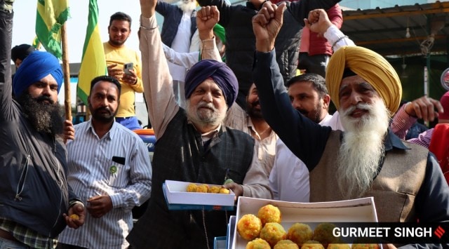 Celebrations by farmers at one of the protest sites on Ferozepur Road in Ludhiana after the farm laws were repealed on Friday. (Express Photo by Gurmeet Singh)