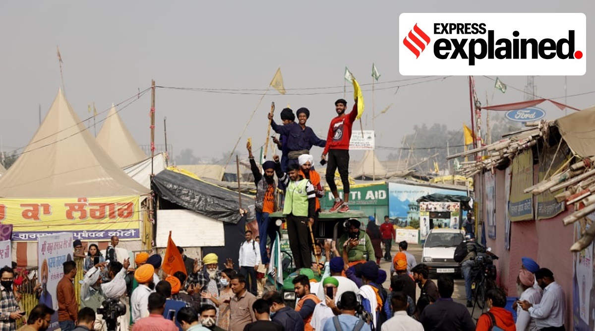 Farmers celebrating at Singhu border in Haryana after the announcement of repeal of agri laws. (Express photo by Praveen Khanna)
