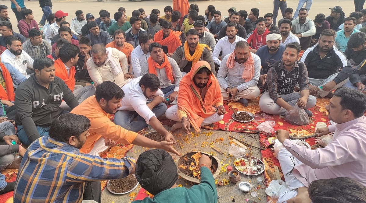 At noon, over 100 men sat at the open ground, where namaz was also disrupted last week as well, and participated in the havan. (Express Photo)