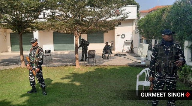CRPF personnel stand guard as the Income Tax Department searches the office of Golf Link Apartments, a project of SAD MLA Manpreet Ayali. (Express Photo by Gurmeet Singh)