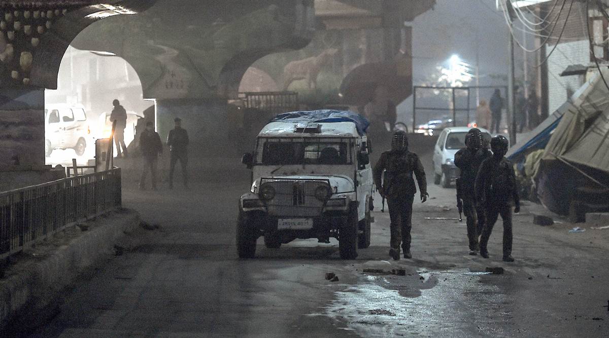 Security personnel on a patrol after an encounter with suspected militants near Rambagh, Srinagar. (PTI)