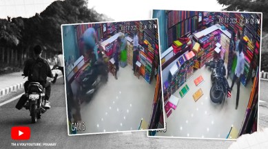 bike crash video, bike crash into clothing store, telangana biker crash into shop, biker crash into shop customers escape, viral video, indian express