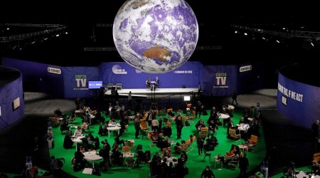Delegates gather inside the venue at the COP26 U.N. Climate Summit in Glasgow, Scotland. (AP)