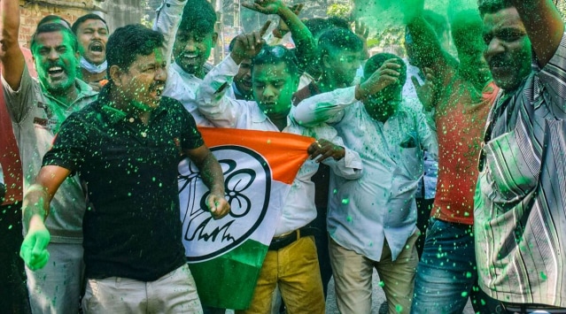 TMC supporters celebrate as the party candidate Brajkishore Goswami is leading during the counting of votes of Santipur assembly constituency by-elections, in Nadia, Tuesday, Nov. 2, 2021. (PTI Photo)