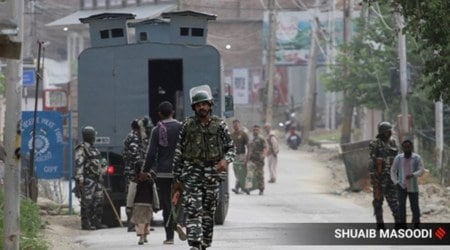 Paramilitary soldiers patrol in a market in Srinagar, Kashmir. 