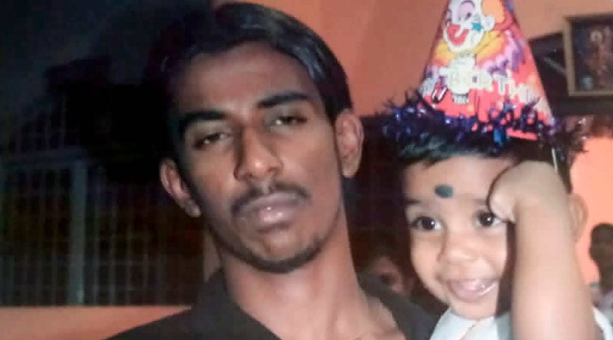 Nagaenthran K. Dharmalingam holding his nephew in Ipoh, Malaysia. (Courtesy of Sarmila Dharmalingam via AP)