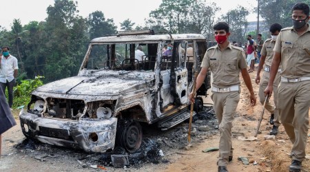 Charred remains of a police vehicle after migrant workers allegedly clashed among themselves on Saturday, in Kochi. (PTI)