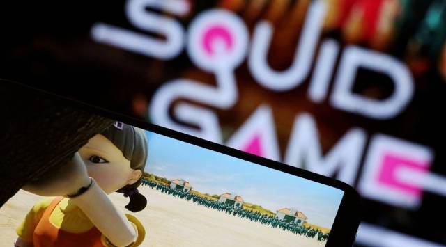 The Netflix series "Squid Game" is played on a mobile phone in this picture illustration. (REUTERS)