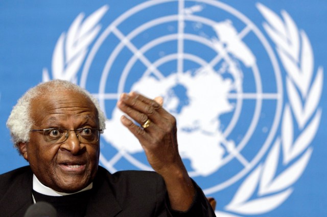 South Africa's Desmond Tutu, Archbishop and Nobel Peace Prize laureate, reacts about Israel blocked Tutu's UN mission to Beit Hanun, during a press conference at the United Nations in Geneva, Switzerland, Monday, Dec. 11, 2006.  South Africa’s Nobel Peace Prize-winning activist for racial justice and LGBT rights and retired Anglican Archbishop of Cape Town, has died, South African President Cyril Ramaphosa announced Sunday, Dec. 26, 2021. He was 90. (Salvatore Di Nolfi/Keystone via AP)