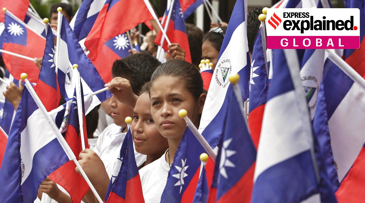 Students holding Taiwanese and Nicaraguan flags take part in a farewell ceremony for Taiwan's President Chen Shui-bian, in Managua, Nicaragua, Aug. 28, 2007. (AP Photo/Esteban Felix, File)