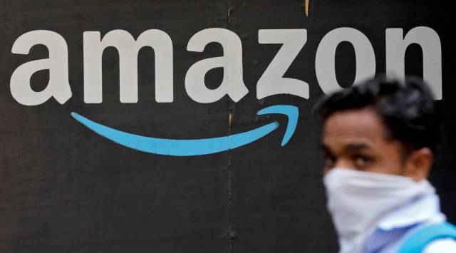 A man walks past an Amazon logo in Mumbai, India, March 19, 2021. (REUTERS/File Photo)