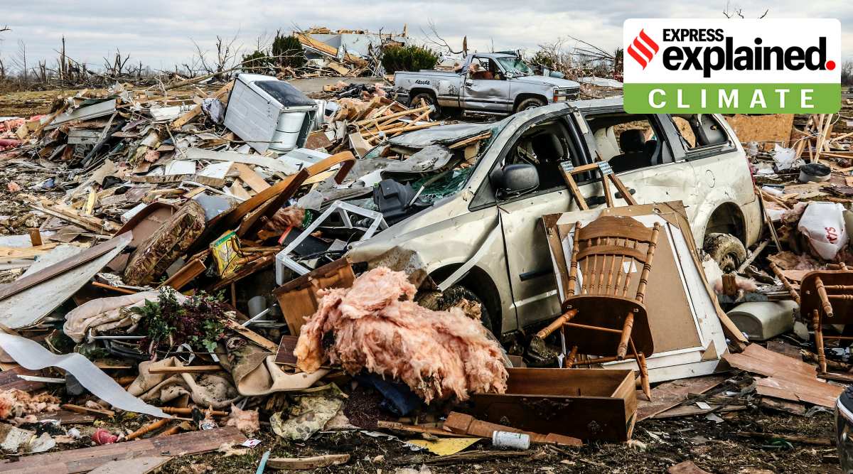 A debris field of damaged Vehicles and personal property are strewn over a wide area along Kentucky 81, Saturday, Dec. 11, 2021, in Bremen, Ky, after a devastating tornado swept through  area on Friday night. (Greg Eans/The Messenger-Inquirer via AP)