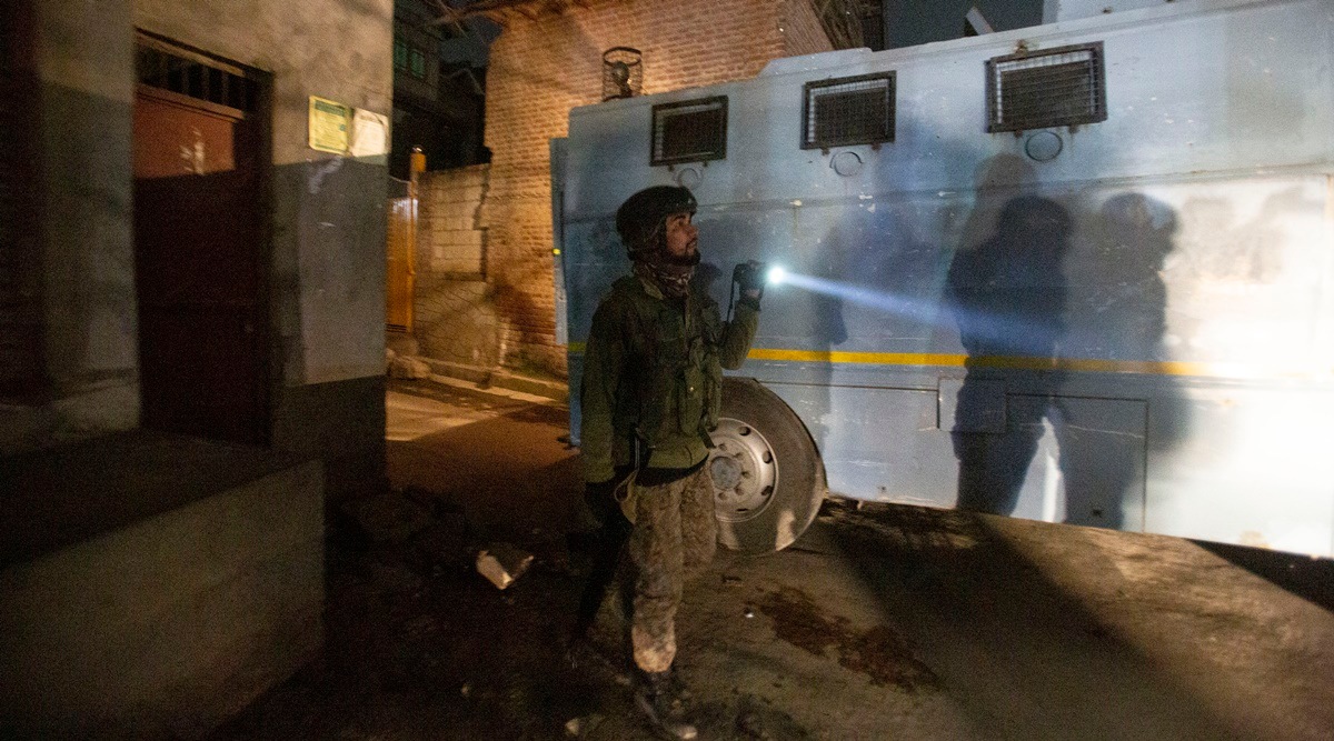 A soldier guards near the site of an attack on the outskirts of Srinagar (AP)