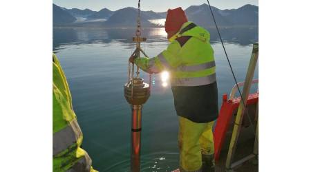 Researchers extracting a sediment core from the seafloor of Kongsfjorden, a fjord at the far eastern end of the Fram Strait between the Norwegian archipelago of Svalbard and Greenland. (Sara Giansiracusa via The New York Times)