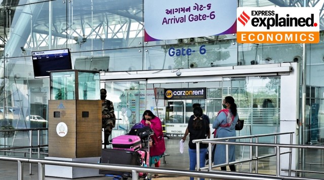 Passengers exiting from the arrivals gate of the international terminal of Sardar Vallabhbhai Patel International Airport, Ahmedabad. (Express Photo: Nirmal Harindran)