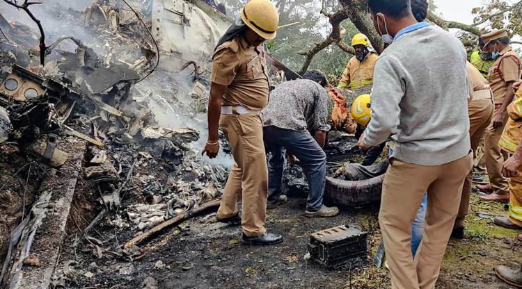 Rescue workers at the site of the helicopter crash in Coonoor, Tamil Nadu, on Wednesday. (PTI)