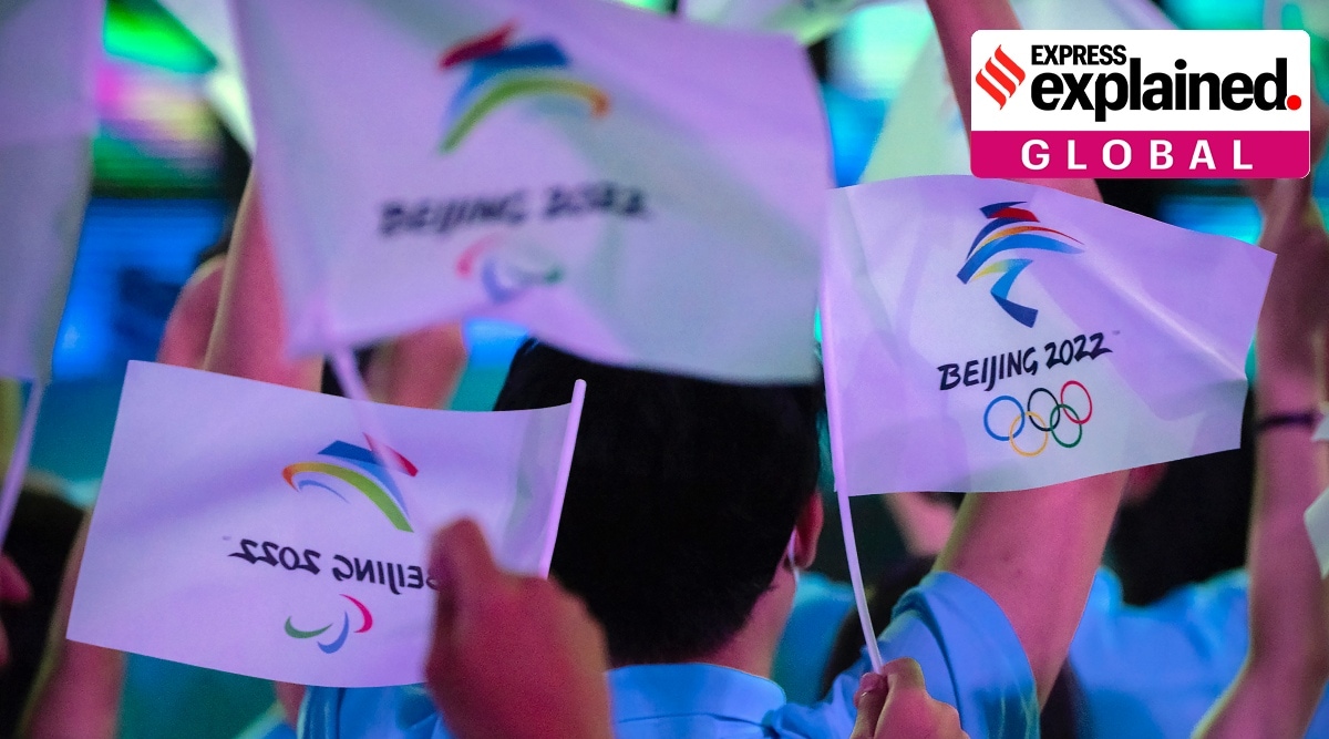 Participants wave flags before a launch ceremony to reveal the motto for the Winter Olympics and Paralympics in Beijing on Sept. 17, 2021. (AP Photo/Mark Schiefelbein, File)


