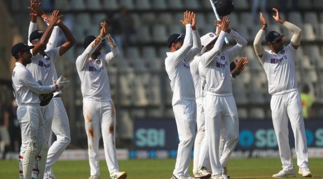 India's cricketers celebrate after winning on the day four of their second test cricket match with New Zealand in Mumbai, India, Monday, Dec. 6, 2021.India won the won the series 1-0. (AP Photo/Rafiq Maqbool)