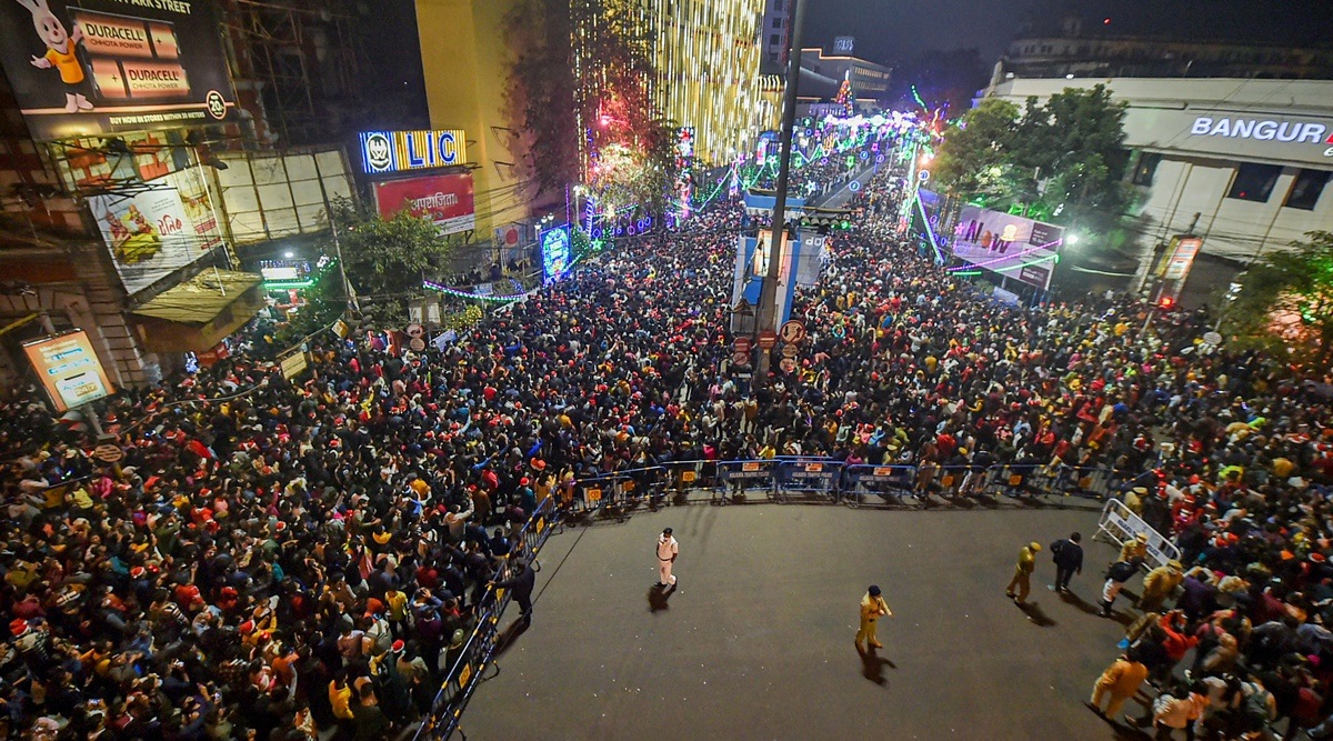 The crowd at Park Street in Kolkata on Christmas. The city's Covid-19 positivity rate has shot up to 12.5 per cent as cases keep surging. (Photo: PTI)