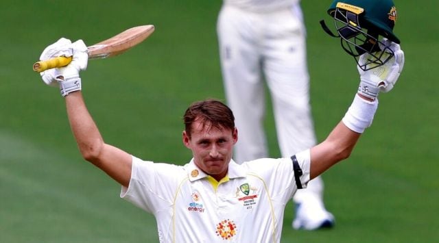 Australia's Marnus Labuschagne celebrates making 100 runs against England during the second day of their Ashes cricket test match in Adelaide, Australia, Friday, Dec. 17, 2021. (AP Photo/James Elsby)