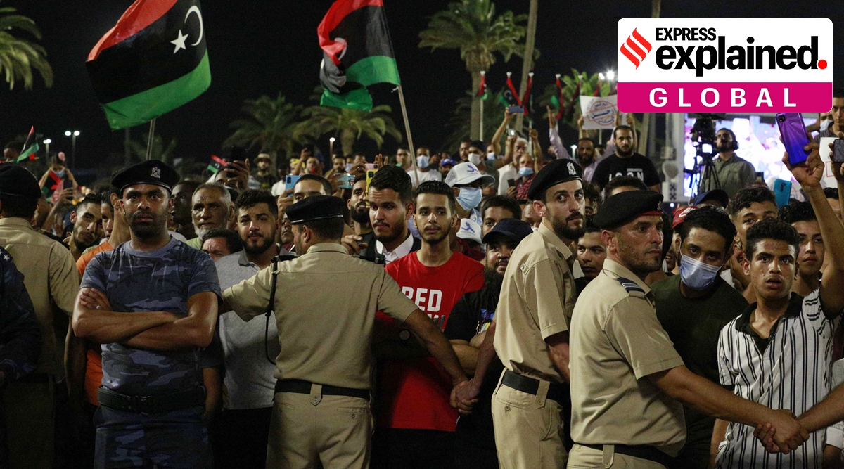 Demonstrators protest in Tripoli, Libya, on Sept. 24, 2021, in opposition to parliament passing a vote of no-confidence in the transitional government. (AP)