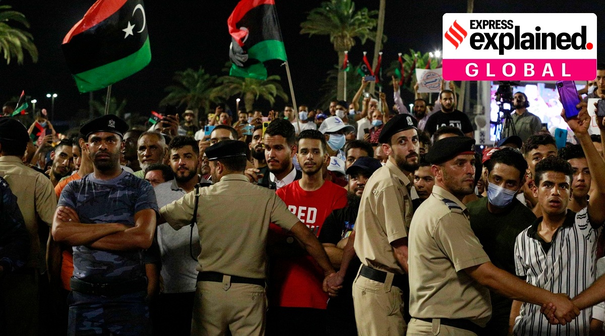 Demonstrators protest in Tripoli, Libya, on Sept. 24, 2021, in opposition to parliament passing a vote of no-confidence in the transitional government. (AP)