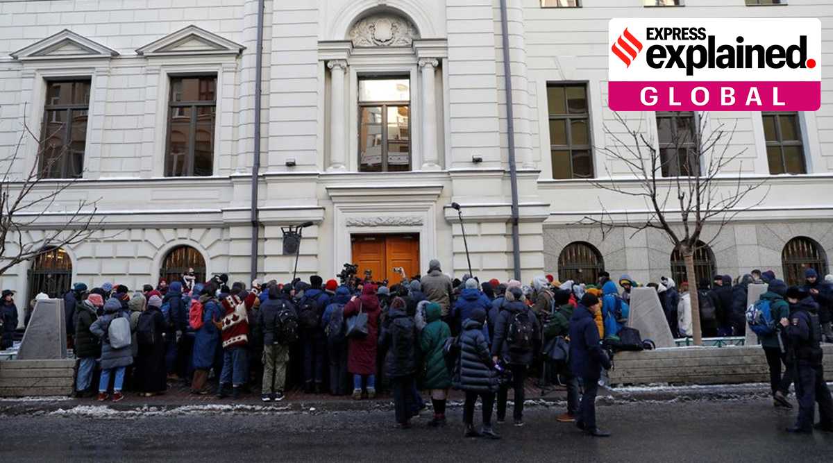 Supporters of the human rights group International Memorial and journalists gather outside a court building during a hearing of the Russian Supreme Court to consider the closure of International Memorial in Moscow, Russia December 28, 2021. (Reuters)
