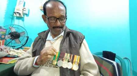 War veteran Nikhil Chandra Ghosh with his medals from the 1971 war.